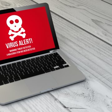 f-secure, antivirus, benefits, software, virus alert on red background on laptop display gray wooden floor